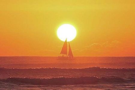 Board from Waikiki Beach for a scenic Sunset Sail on the Hāwea