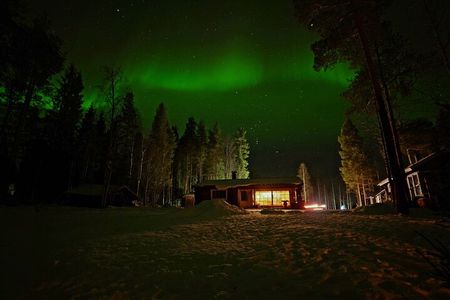Northern Lights Hunting in Lappish old cottage