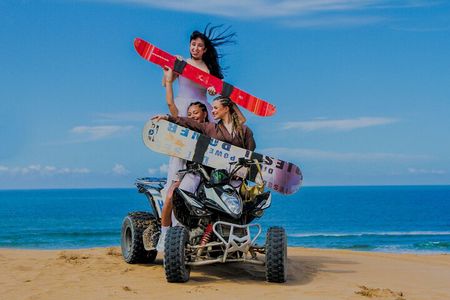 Quad Bike and Sandboarding on Sand Dunes Wild Beach