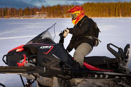 Snowmobiles and Huskies