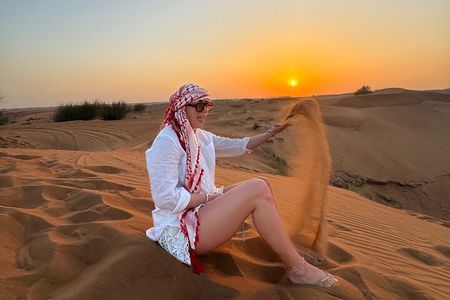 Premium Desert Safari with Pickup,Quad Bike,Camel Ride & Dinner