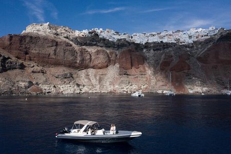 Island hopping (Santorini & Ios)on a private motorboat 
