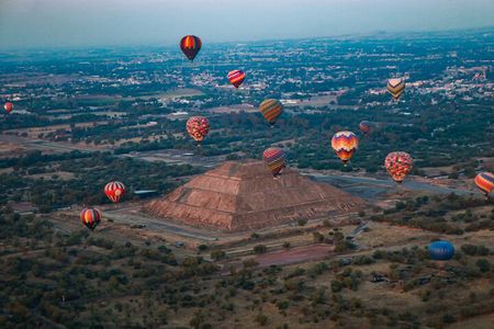 Flight + Transportation + Breakfast + Tour and Pyramid Ascent.