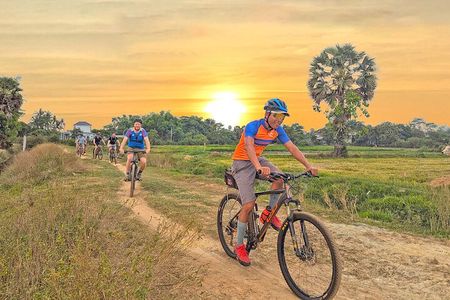 Bike the Siem Reap Countryside at Twilight with Sunset Drink