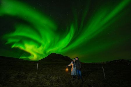Northern Lights Tour with Photos, Snacks, Warm Snowsuits & Chairs