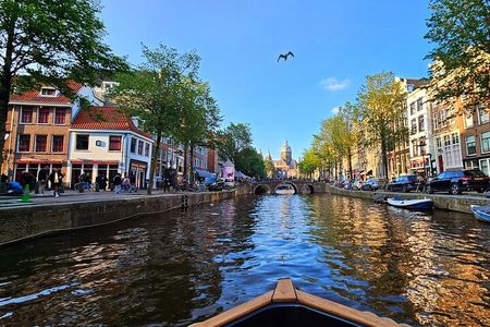 Amsterdam Canal Tour by Open Boat – 90 min Small Group Experience