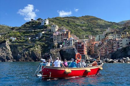 Boat ride from Riomaggiore with stop for swimming and local wine.
