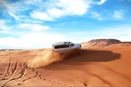 Qatar Shared Desert Safari with Sandboarding and Camel Ride