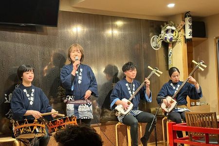 Tsugaru shamisen performance over traditional dinner