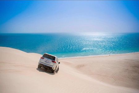 Doha Escape: Gentle Desert Safari with Camel Ride & Sandboarding