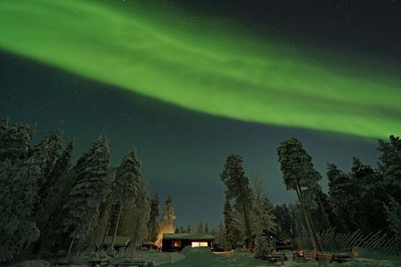Northern Lights Hunting in Lappish old cottage