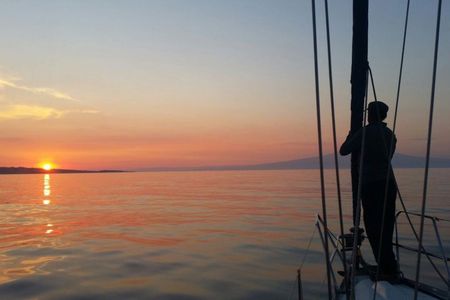 Aperitif on a sailing boat at sunset in Catania