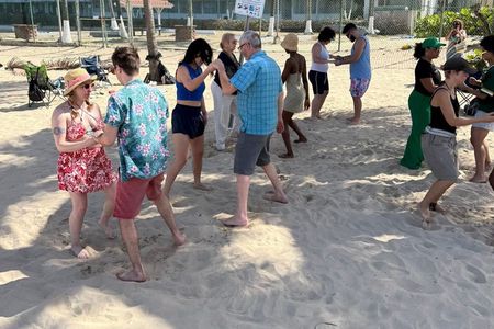 Coquito Drink and Salsa Beach Class