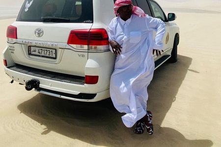 Qatar Desert Adventure Dune Bashing Camel Ride and Falcon photo