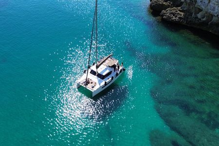 Catamaran tour stops bathing and snorkeling toast with prosecco
