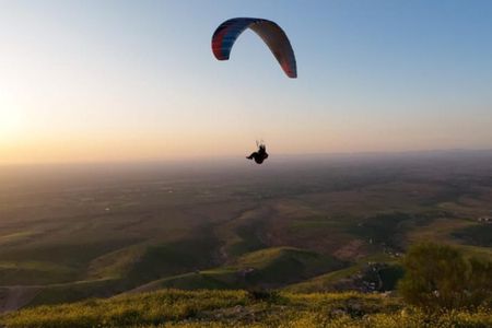 Tandem Paragliding Adventure Over Desert Mountains