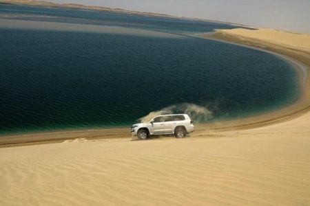 Qatar Shared Desert Safari with Sandboarding and Camel Ride