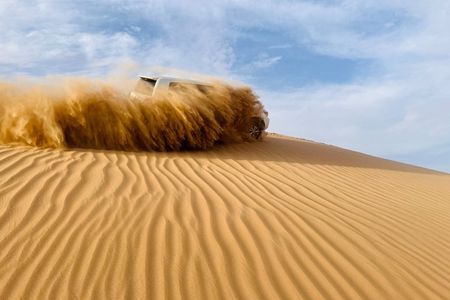 Abu Dhabi Morning Desert Safari with Camel Ride & Sandboarding