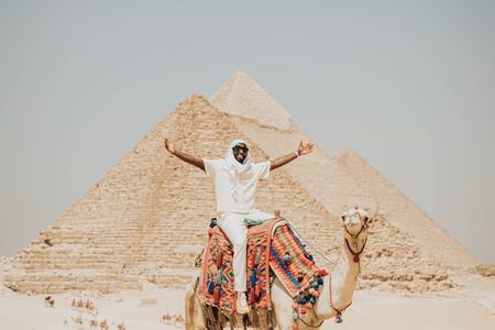 Camel Ride around the Pyramids During Sunrise Or Sunset