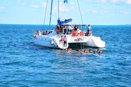 Snorkeling Catamaran to Isla Mujeres with Beach Club & Party