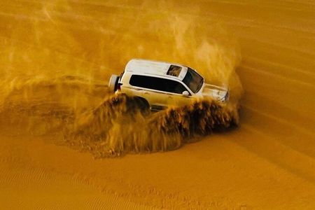 Abu Dhabi Desert safari with BBQ Dinner,Sandboarding & Camel ride