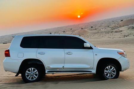 Abu Dhabi Desert Safari with Sandboarding, Camel Ride & Dinner