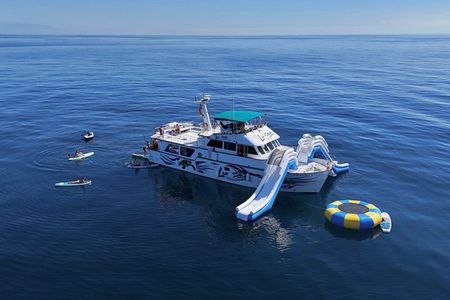 Boat: XXL slides, snorkel, activities, lunch and pickup