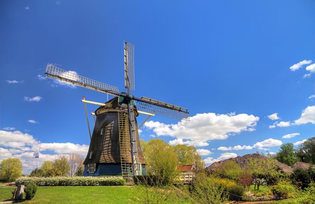 Countryside bike tour with windmill, cheese and clogs
