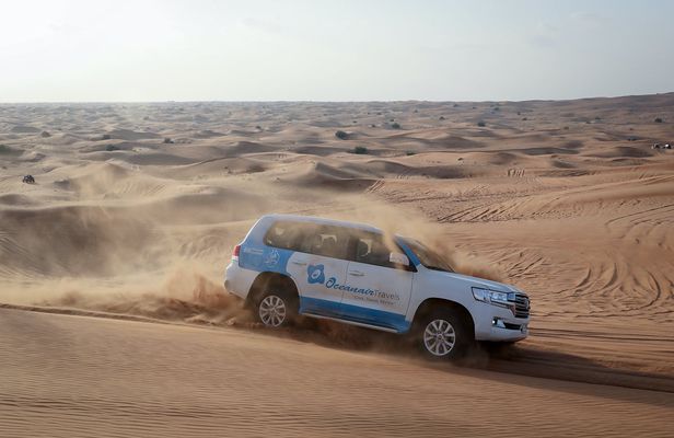 Abu Dhabi desert safari with BBQ, camel ride and sandboarding