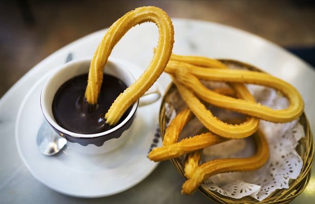 Self-balancing scooter tour in Madrid with chocolate con churros