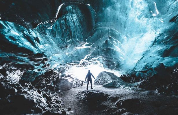 Explore a blue ice cave