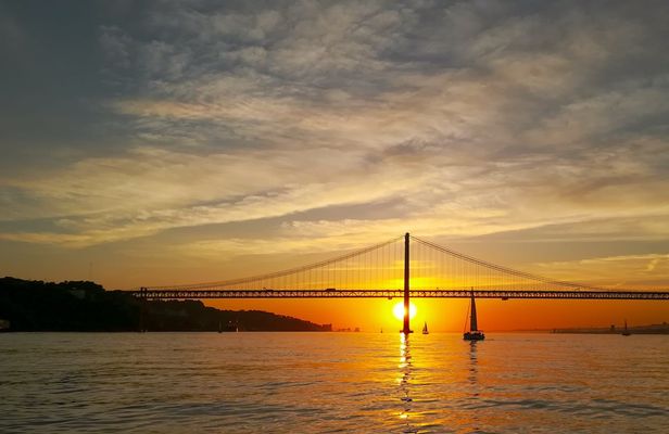 Small-group Lisbon sunset sailing cruise with a welcome drink