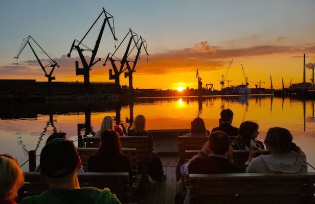Sunset on the shipyard and old town cruise in Gdansk