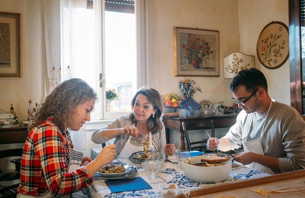 Market tour and dining experience at a Cesarina's home in Modena