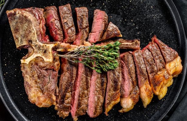Florentine-style steak cooking experience with a chef and unlimited wine