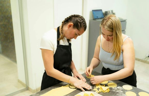 Fresh pasta and tiramisù cooking class with wine pairing in Milan