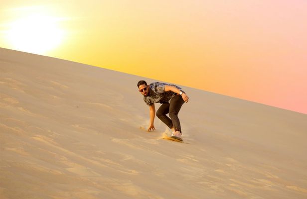 Abu Dhabi sunrise desert adventure with dune bashing and camel ride