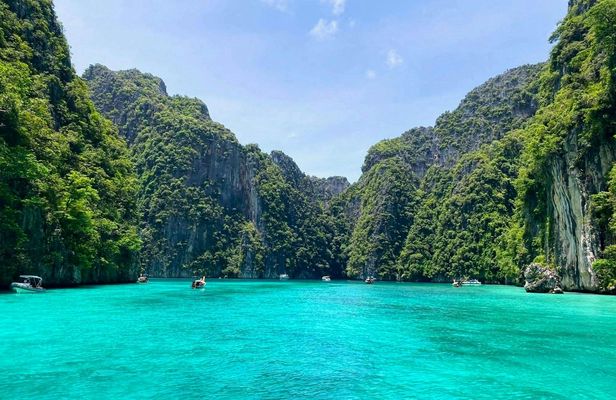 Sunrise Phi Phi cove collection with longtail boat from Krabi
