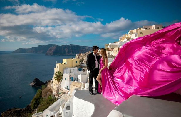 Santorini flying dress photoshoot with caldera and Oia views