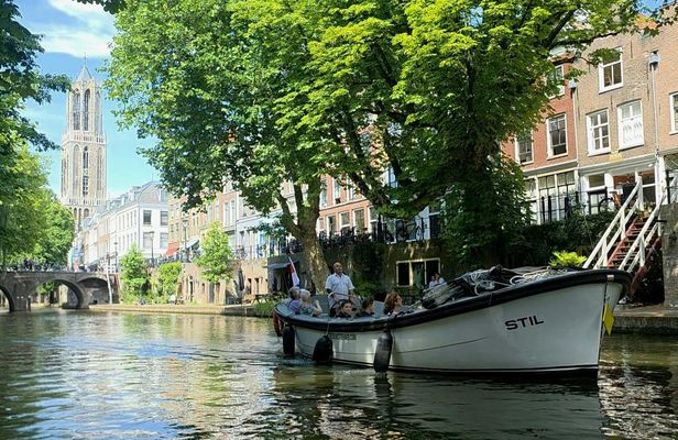 Utrecht canal cruise in open boat with drink and audio guide