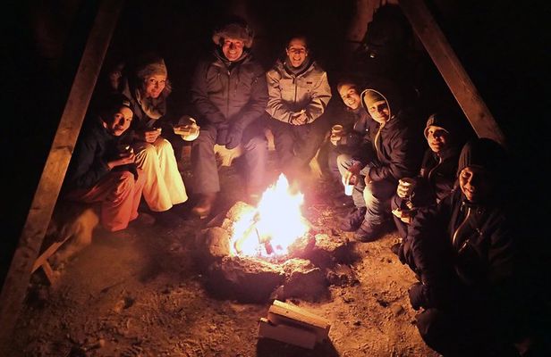 Snowshoe trip with a campfire in Tromso