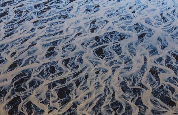 Airplane tour over black sands and riverbeds from Skaftafell