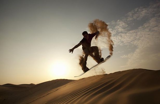 Private Desert Sandboarding Camel riding tour