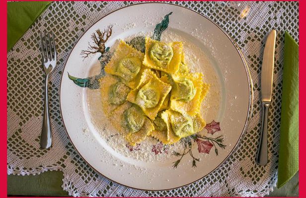 Dining experience at a local's home in Parma with show cooking