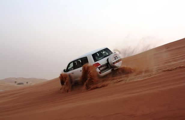 Morning Desert Safari: Dune Bashing, Sand boarding & Camel Ride