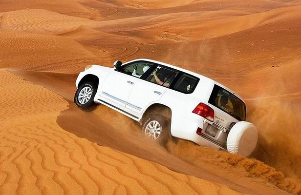 Golden Dunes & Sunset Safari with BBQ, Camel Ride & Sandboarding