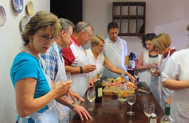 Cooking class, visit to the wine cellar, 2500 year old granaries