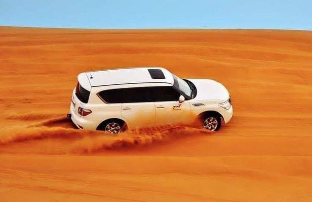 Dubai Desert Afternoon Safari with Camel Ride, BBQ Dinner, and Belly Dancing