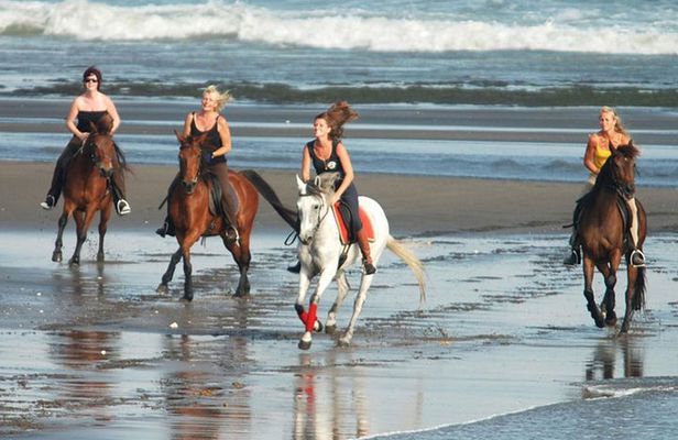 Riding a Horse to Enjoy the Extremely Black Sand Beach