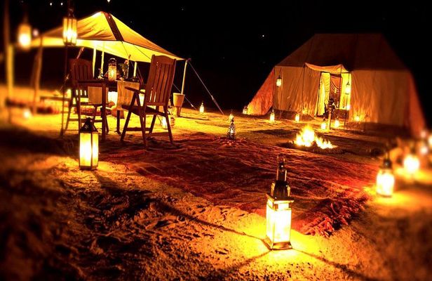 Overnight Desert Safari with Dune Bashing, Belly Dance, Camel Ride and Breakfast